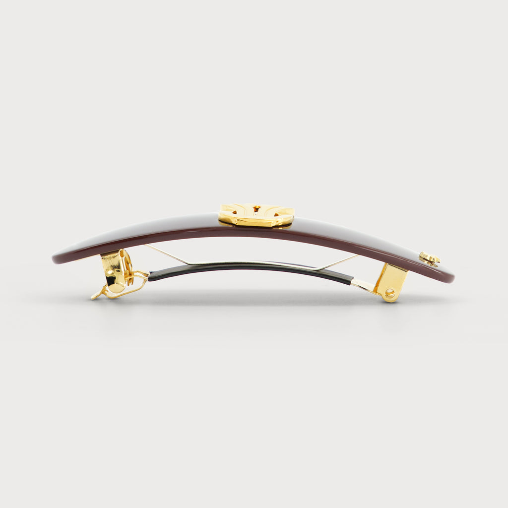 Barrette cheveux luxe knot or ovale laiton doré vue de profil bordeaux pour coiffures chics