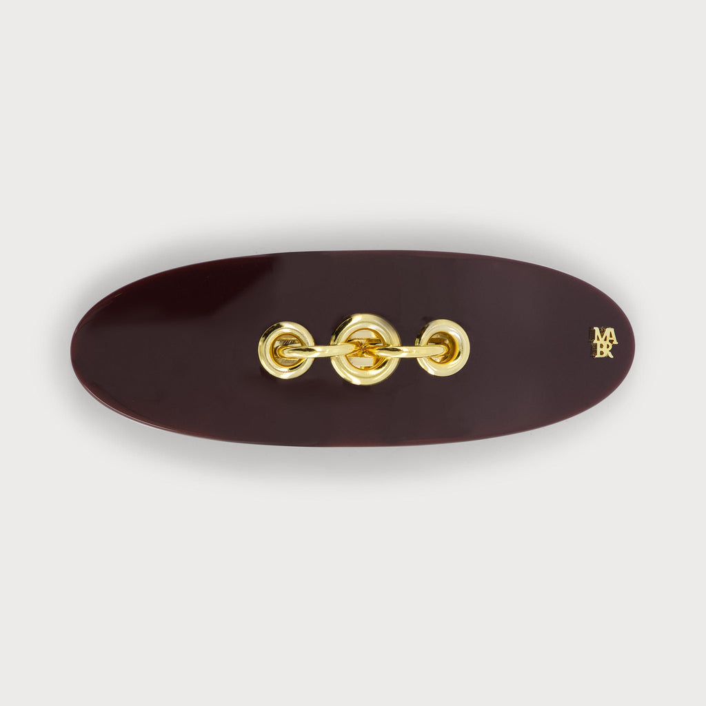 Barrette à cheveux confectionnée en France auprès d'artisans luxe couleur bordeaux et dorée finitions Eyelets