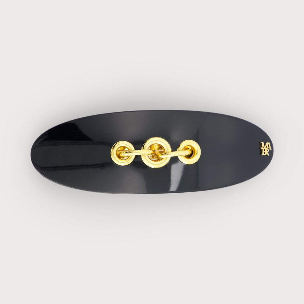 Barrette à cheveux confectionnée en France auprès d'artisans luxe couleur Noire et dorée finitions Eyelets